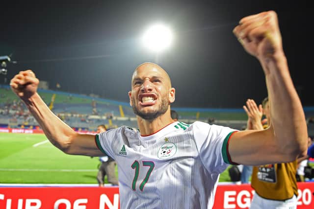 Algeria's midfielder Adlene Guedioura celebrates after winning the 2019 Africa Cup of Nations (CAN) Round of 16 football match between Algeria and Guinea at the 30 June Stadium in the Egyptian capital Cairo on July 7, 2019. (Photo by MOHAMED EL-SHAHED / AFP)        (Photo credit should read MOHAMED EL-SHAHED/AFP via Getty Images)