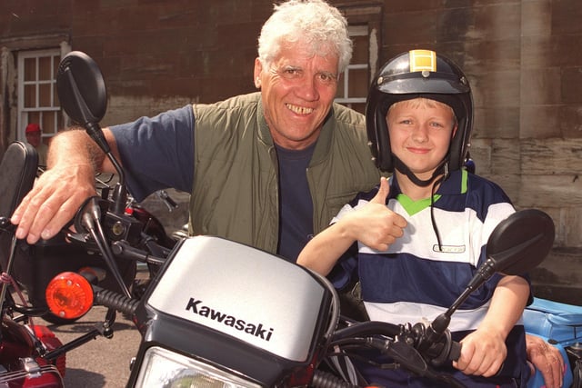 Eight-year-old Steven Marsden gets a few tips from his grandad Peter Leech at the Cusworth Hall Bike Rally in 2000