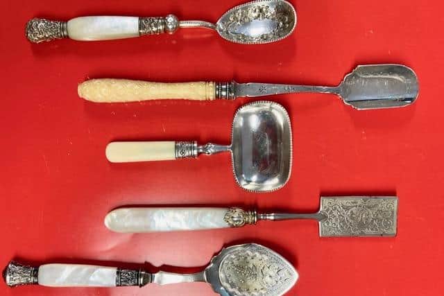 Top to bottom: a jam spoon with decorated ferrule and finial, Stilton scoop with carved ivory handle, butter spade, caviar and bon bon spoon and an unusual serving spoon whose purpose is unknown. All from the Dennis Smith bequest to the Hawley Collection