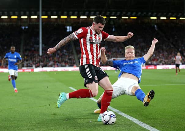 Sheffield United's Oliver Burke (left) and Birmingham City's Kristian Pedersen battle for the ball: Nigel French/PA Wire.