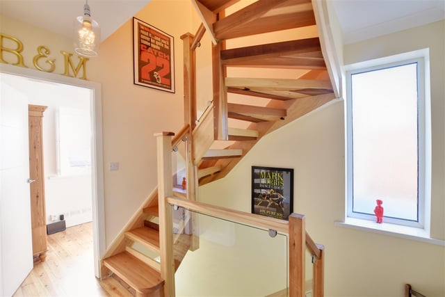 The staircase leads up to a converted loft.