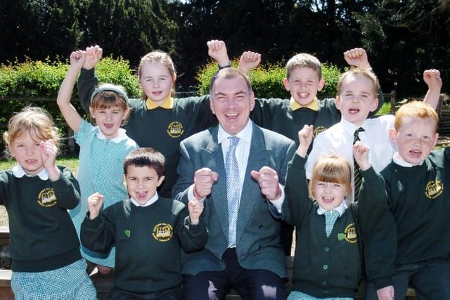 Edenthorpe Hall Primary School pupils and head teacher celebrate receiving a good often report in 2007.