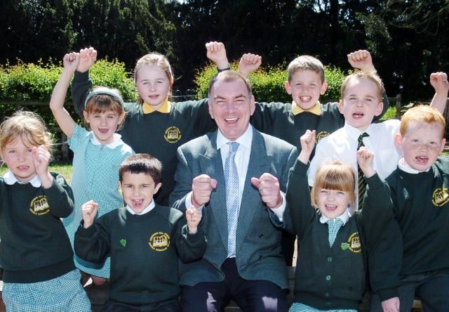 Edenthorpe Hall Primary School pupils and head teacher celebrate receiving a good often report in 2007.