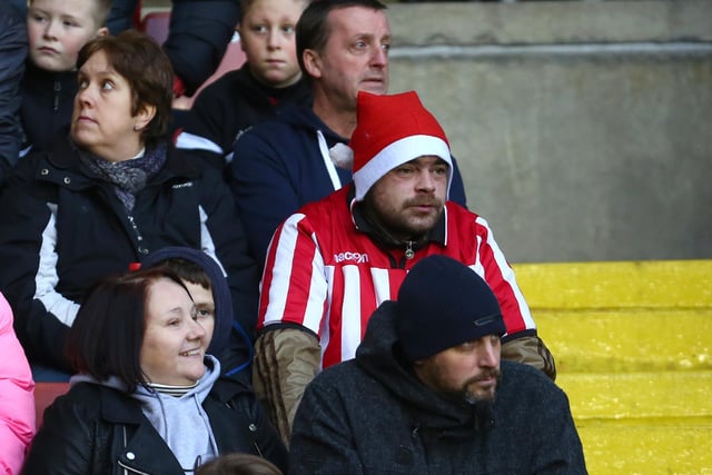 United supporters get into the festive spirit during the game against Bradford City in December 2015.