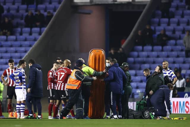 John Fleck of Sheffield United (not pictured) receives medical treatment during the Sky Bet Championship match between Reading and Sheffield United  (Photo by Ryan Pierse/Getty Images)