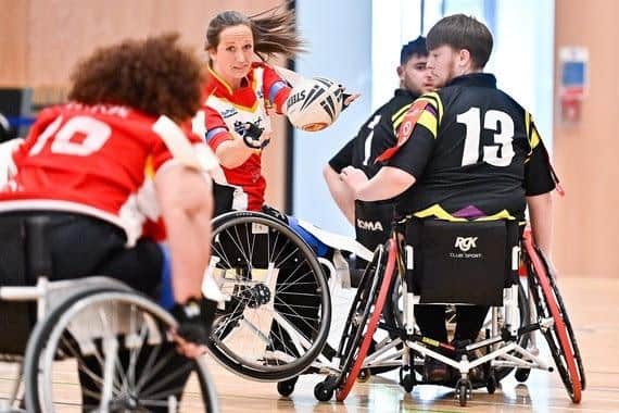 Sheffield Eagles Wheelchair player Emma Pearson goes for the ball against Mersey Storm. Sheffield is a host city for the Rugby League World Cup, which features men's, women's and wheelchair matches