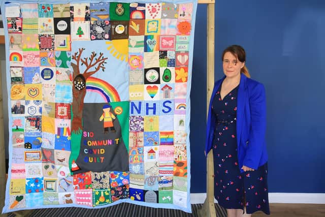 The community quilt was the culmination of a Year long effort by the residents of Crosspool to record and recognise the life we are living under the Covid pandemic. Pictured is Amy Chambers. Picture: Chris Etchells