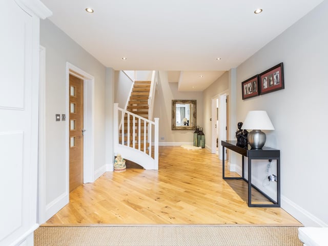 The "substantial entrance hall" provides access to the ground floor accommodation.