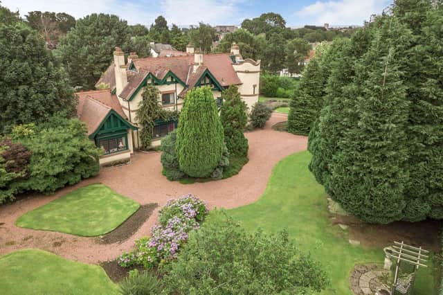 The home is surrounded by lush woodlands, an acre of landscaped gardens and a park.