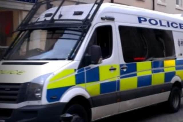 A girl aged 13 was arrested as a police officer was reported assaulted after three people were asked to leave a Sheffield pub. File picture shows a police van