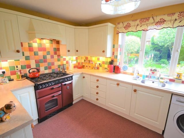 Kitchen - Well presented kitchen with an excellent range of shaker style wall and base units finished in cream with contrasting work surfaces, ceramic wall tiles and under wall cupboard lighting, having a stainless steel wash bowl with draining board, nicely positioned to a UPVC double glazed window which provides a great outlook to the rear garden, all integrated appliances are Bosch and include a tall fridge freezer, separate additional freezer and a brand new dishwasher, there is space for a free standing 90mm Rangemaster cooker and provisions for a washing machine. There is a useful storage cupboard and open plan access to the breakfast room.