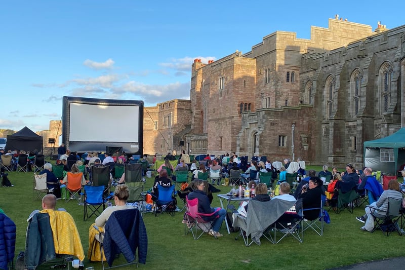 A glow within the grounds of Bamburgh Castle on Friday, August 13, 2021, as the sun goes down ahead of the screening of Dirty Dancing.