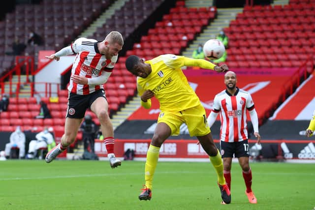 Oli McBurnie of Sheffield Utd heads towards goal which is saved by Alphonso Areolaa of Fulham during the Premier League match at Bramall Lane. Simon Bellis/Sportimage