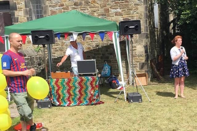 Disco Dave in his iconic attire DJing at Abbey Lane School fair on St Chad's Church field