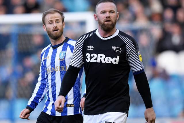 Owls midfielder Barry Bannan pictured next to Wayne Rooney against Derby County at Hillsborough on Saturday . Pic Steve Ellis