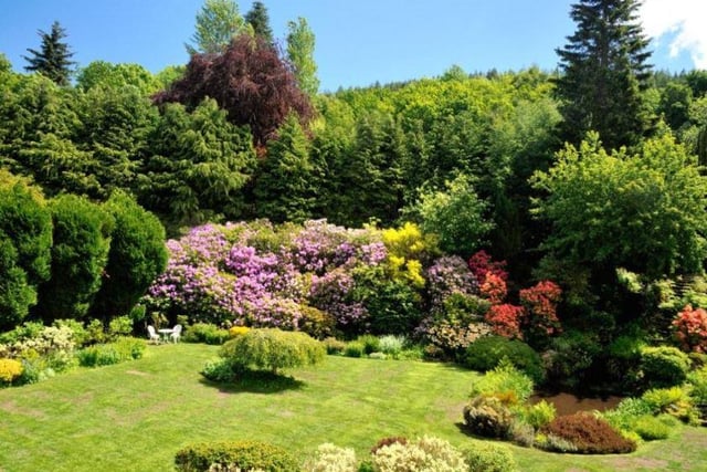 The colourful gardens and grounds contain various shrubs, trees and beautifully tended lawns, and extend for approximately 12 acres.
