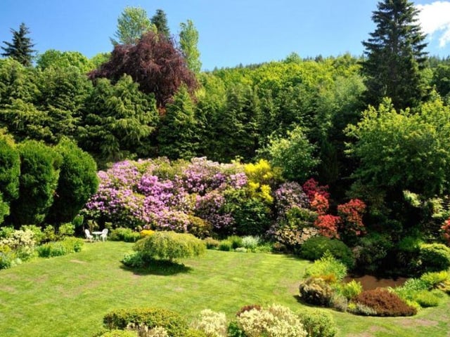 The colourful gardens and grounds contain various shrubs, trees and beautifully tended lawns, and extend for approximately 12 acres.