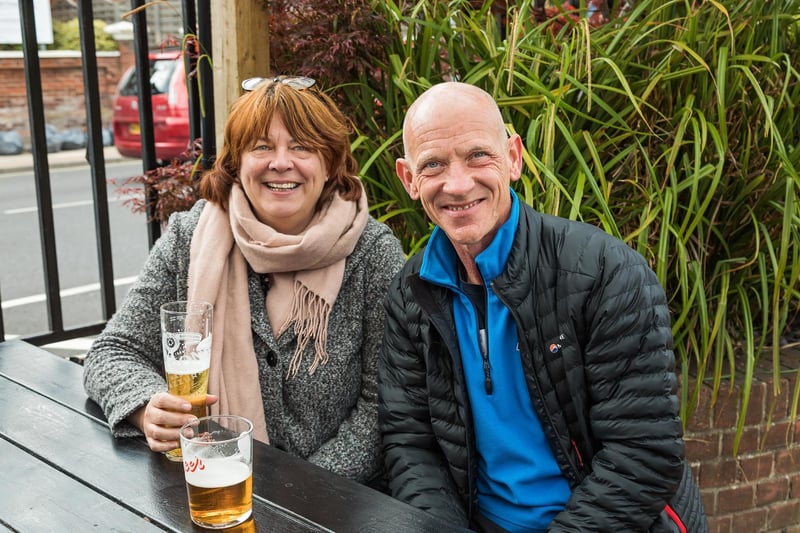 Alison Van Laar (51) and Fintan Murray (56) enjoy a beer in the garden at O'Neills on Albert Road. Picture: Mike Cooter (DDMMYY)