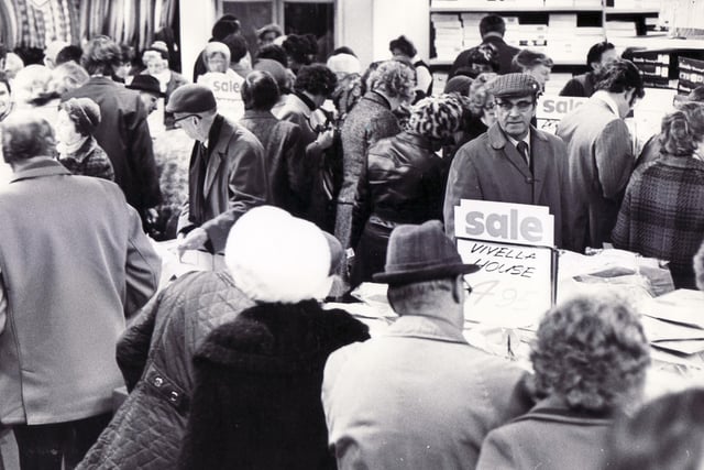 A busy sale scene in the gents department at Walsh's Department Store, High Street, Sheffield in January 1976