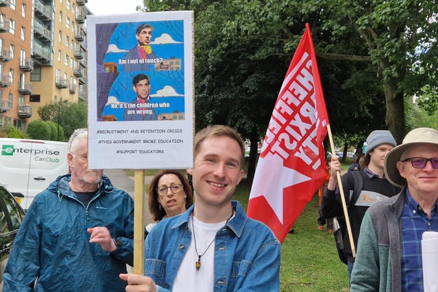 This placard uses a well known meme format from The Simpsons. In the finer print: "Recruitment and retention crisis. This government broke education. Support educators."