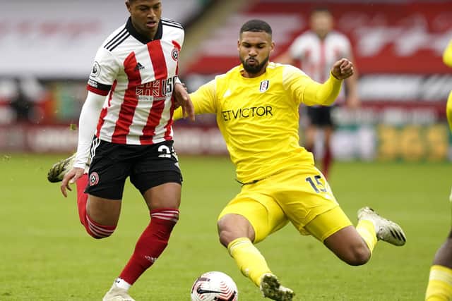 Rhian Brewster of Sheffield United (L) vies with Ruben Loftus-Cheek of Fulham during the Premier League match at Bramall Lane: Andrew Yates/Sportimage