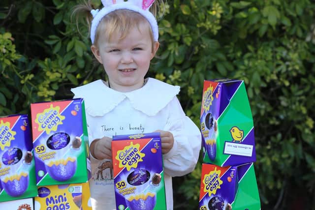 Alice Cleverley is almost 3yrs old and was worried that some boys and girls wouldn't get Easter eggs. So with the help of her mum Lauren Swann she had made bracelets and sold them to raise money for Baby Basics Sheffield. Picture: Chris Etchells