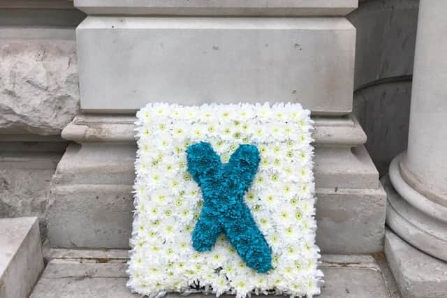The wreath was placed outside the Treasury, whom ExcludedUK want to see rectify the injustice 'once and for all'.