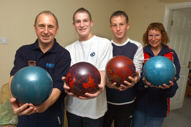 Tony Batty, left, has entered the 10 pin bowling at the World Firefighters games back in 2004, and roped in sons Luke and wife Jill, pictured with youngest son Dane, second from   right back in 2004