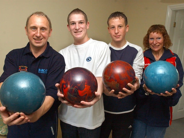 Tony Batty, left, has entered the 10 pin bowling at the World Firefighters games back in 2004, and roped in sons Luke and wife Jill, pictured with youngest son Dane, second from right back in 2004