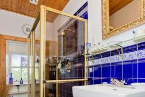Located on the first-floor is a spacious and beautifully tiled shower room