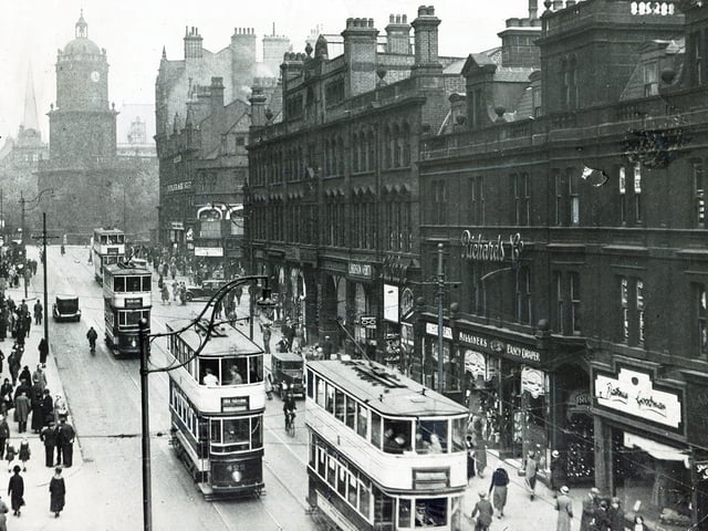Trams make their way along Pinstone Street in the 1930s