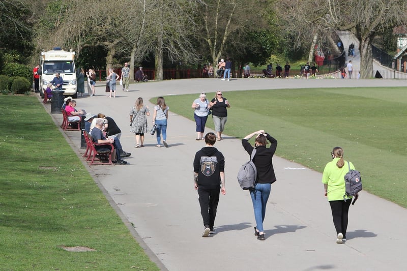 Residents enjoy a walk through Chesterfield's Queen's Park.
