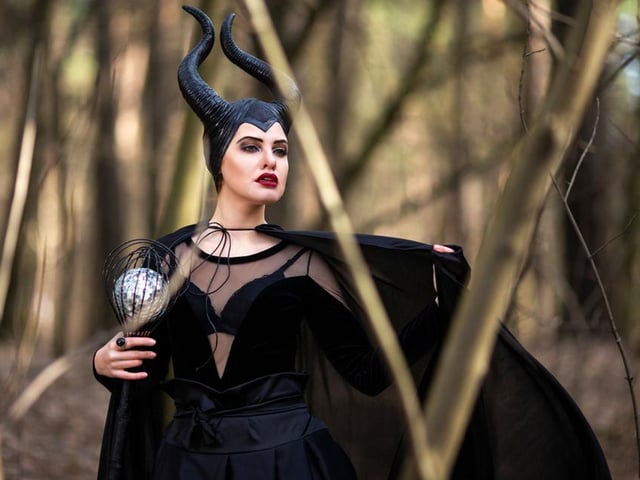 Channel your inner Angelina Jolie and opt for this simple look that just requires a strong contour to create those striking cheekbones, some red lipstick, and winged black eyeliner. Finish the look with Maleficent's iconic horns.