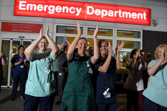 Staff at a hospital join in with the clap for carers (photo: Neil Cross).