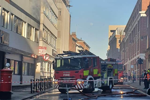 Fire was seen coming out of a top floor window on Queens Street in Sheffield. Picture: Wiktoria Wrzyszcz.