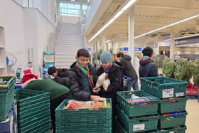 Scouts from 39th Sheffield collect donations for the Burngreave foodbank.