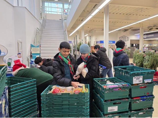 Scouts from 39th Sheffield collect donations for the Burngreave foodbank.