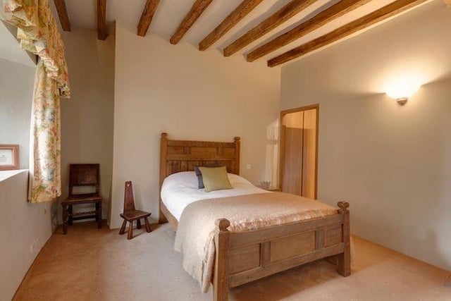 A good sized double bedroom with original oak beams.