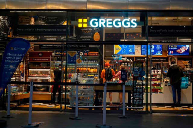 People purchase food in a branch of the bakery chain Greggs (Photo by Niklas HALLE'N / AFP) (Photo by NIKLAS HALLE'N/AFP via Getty Images)