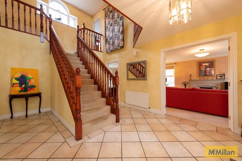 Entrance hall with feature staircase.