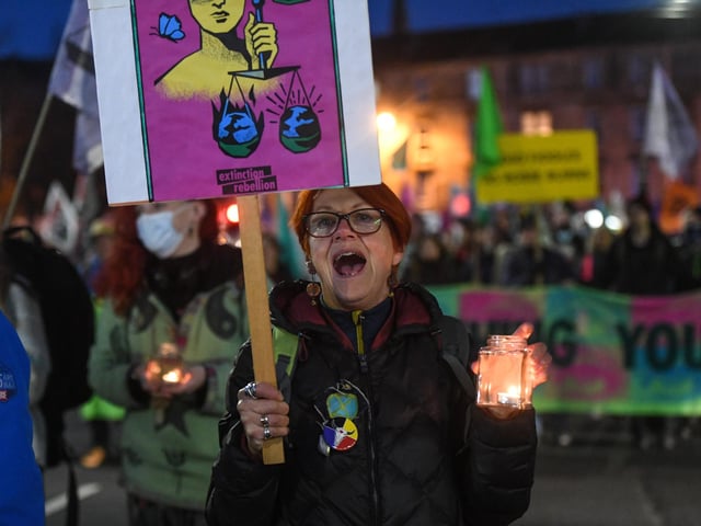 Protesters were seen carrying candles during an Extinction Rebellion candlelit vigil. As World Leaders meet to discuss climate change at the COP26 Summit, many climate action groups have taken to the streets to protest for real progress to be made by governments to reduce carbon emissions, clean up the oceans, reduce fossil fuel use and other issues relating to global heating.