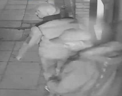 Investigating officers have released a CCTV still  - as well as CCTV footage - of two individuals they believe may hold vital information on the robbery and are appealing for them, or anyone with information, to get in touch