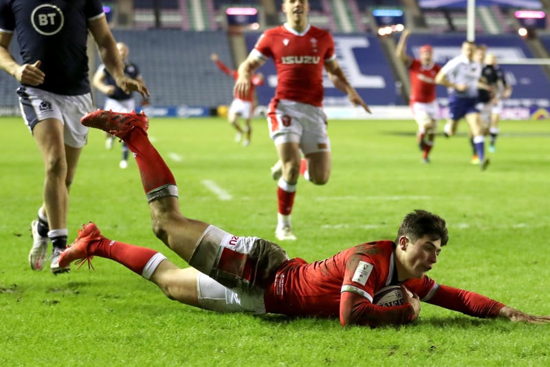Wales' Louis Rees-Zammit dives in to score his sides fourth try during the Guinness Six Nations match at BT Murrayfield Stadium
