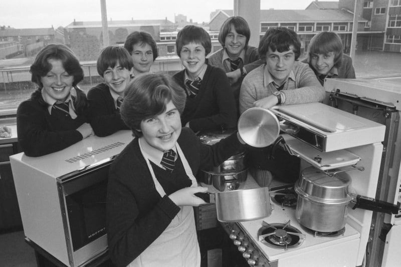 Alison Kell, 14, tries her hand at one of the energy-saving cooking methods as other pupils involved in the Farringdon School experiment look on in this 1979 photo?