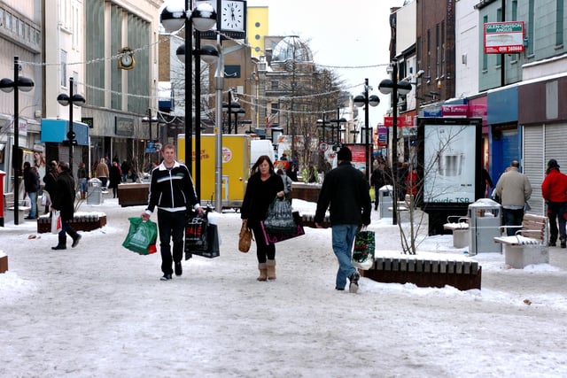 We've not seen one since. Here's the last white Christmas in the UK and shoppers are pictured getting presents on High Street West on Christmas Eve.