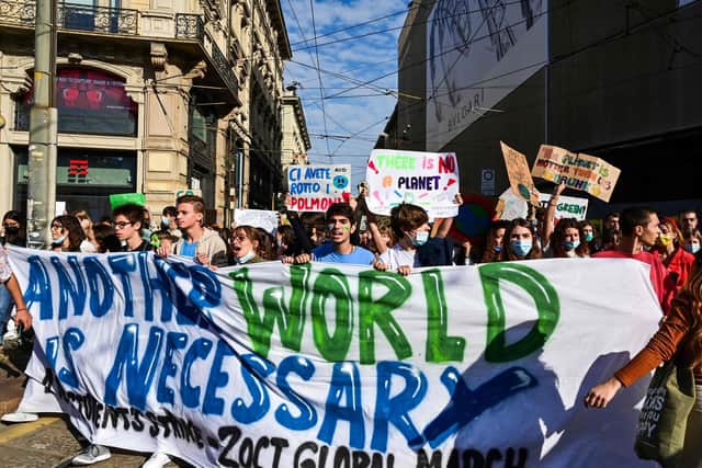Young climate activists march during a Fridays for Future students' strike on October 1, 2021 on the sidelines of the Youth4Climate and Pre-COP 26 events. Getty Images.