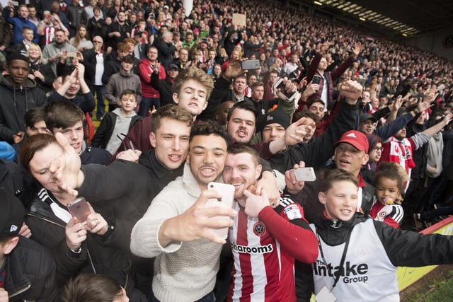John Fleck has a selfie with fans after winning promotion to the Sky Bet Championship following a 3-0 win over Bradford City at the Lane in April 2017.