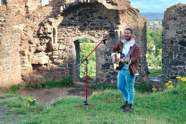 A lone performer plays a gig at the ruin of St Anthony's Chapel.