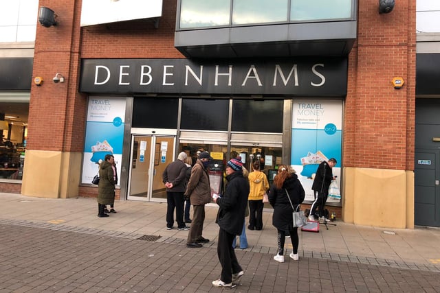 People gather at troubled department store Debenhams, shortly before 9am.