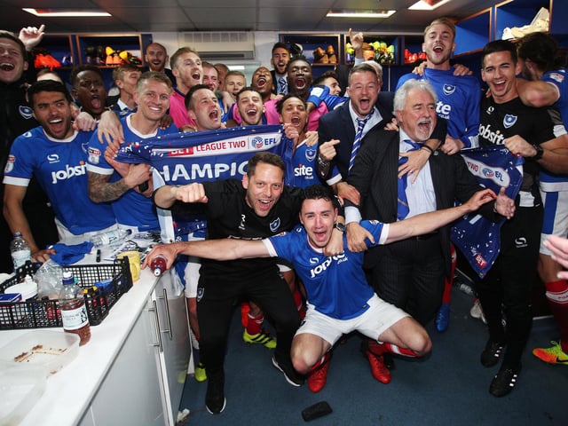 The players and staff in the dressing room.
